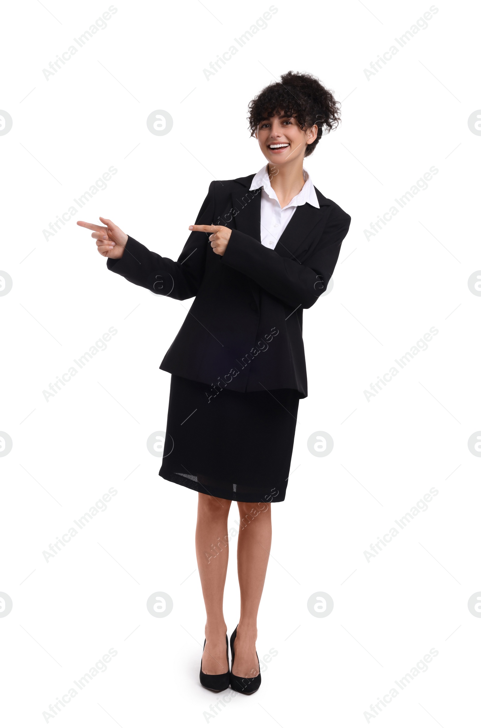 Photo of Beautiful happy businesswoman pointing at something on white background