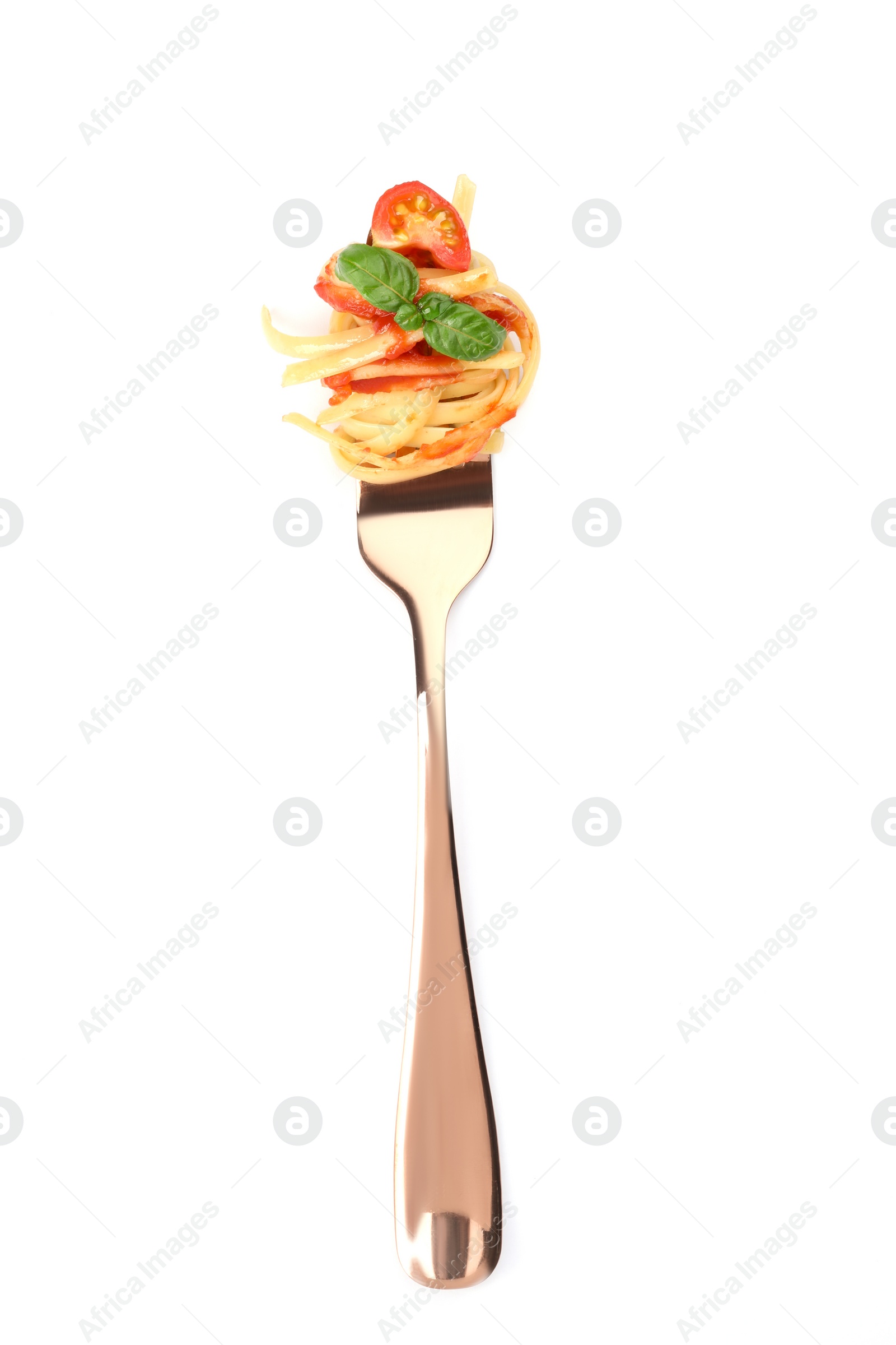 Photo of Fork with tasty pasta, tomato sauce and basil isolated on white, top view