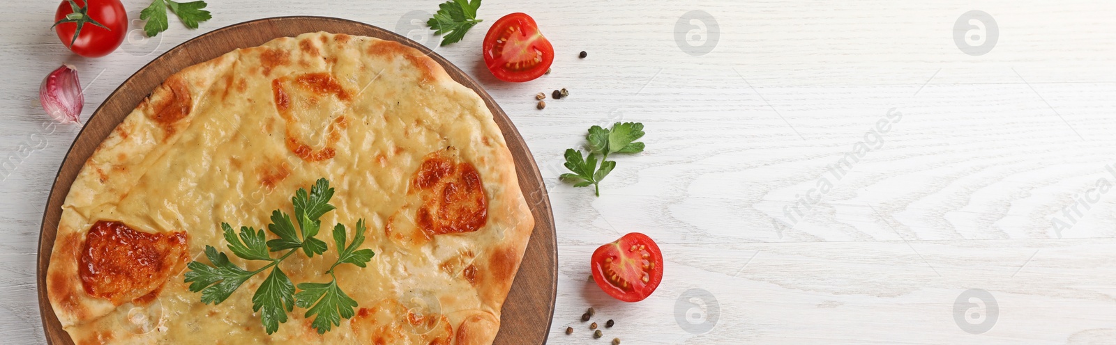 Image of Delicious Megrelian khachapuri served on white wooden table, flat lay. Banner design with space for text