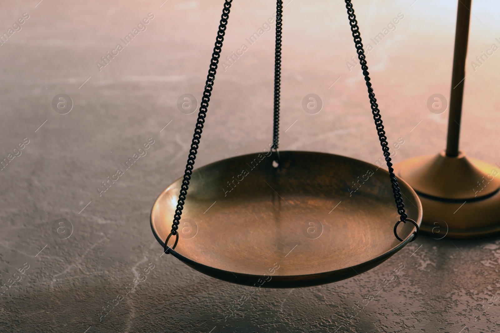 Photo of Scales of justice on table, closeup. Law concept