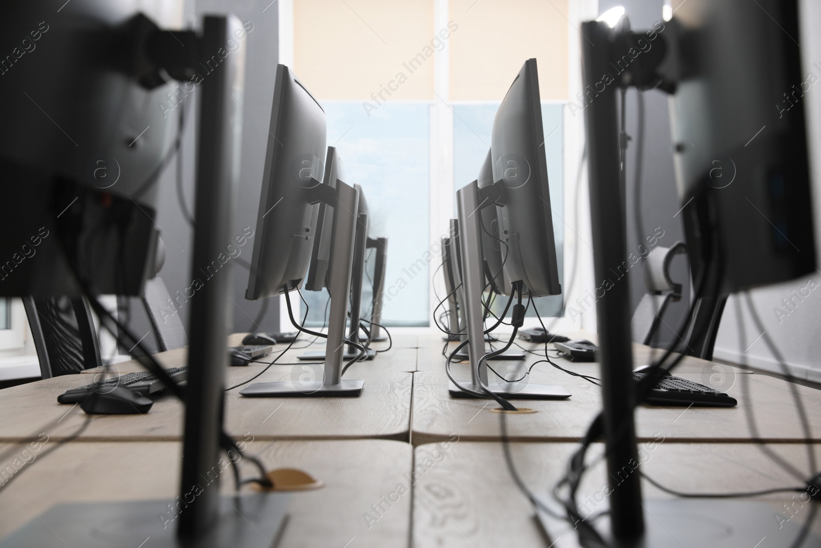 Photo of Many modern computers in open space office