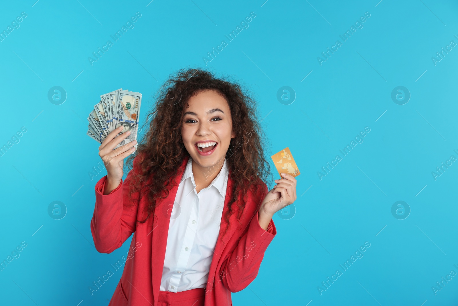 Photo of African-American businesswoman with money and credit card on color background. Space for text