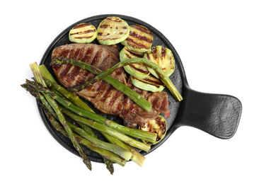 Photo of Tasty grilled meat with asparagus and zucchini isolated on white, top view
