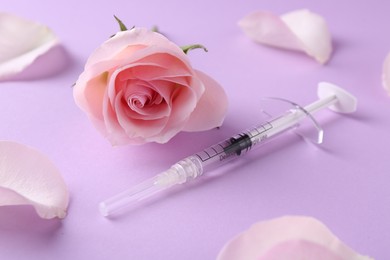 Photo of Cosmetology. Medical syringe, rose flower and petals on pink background, closeup