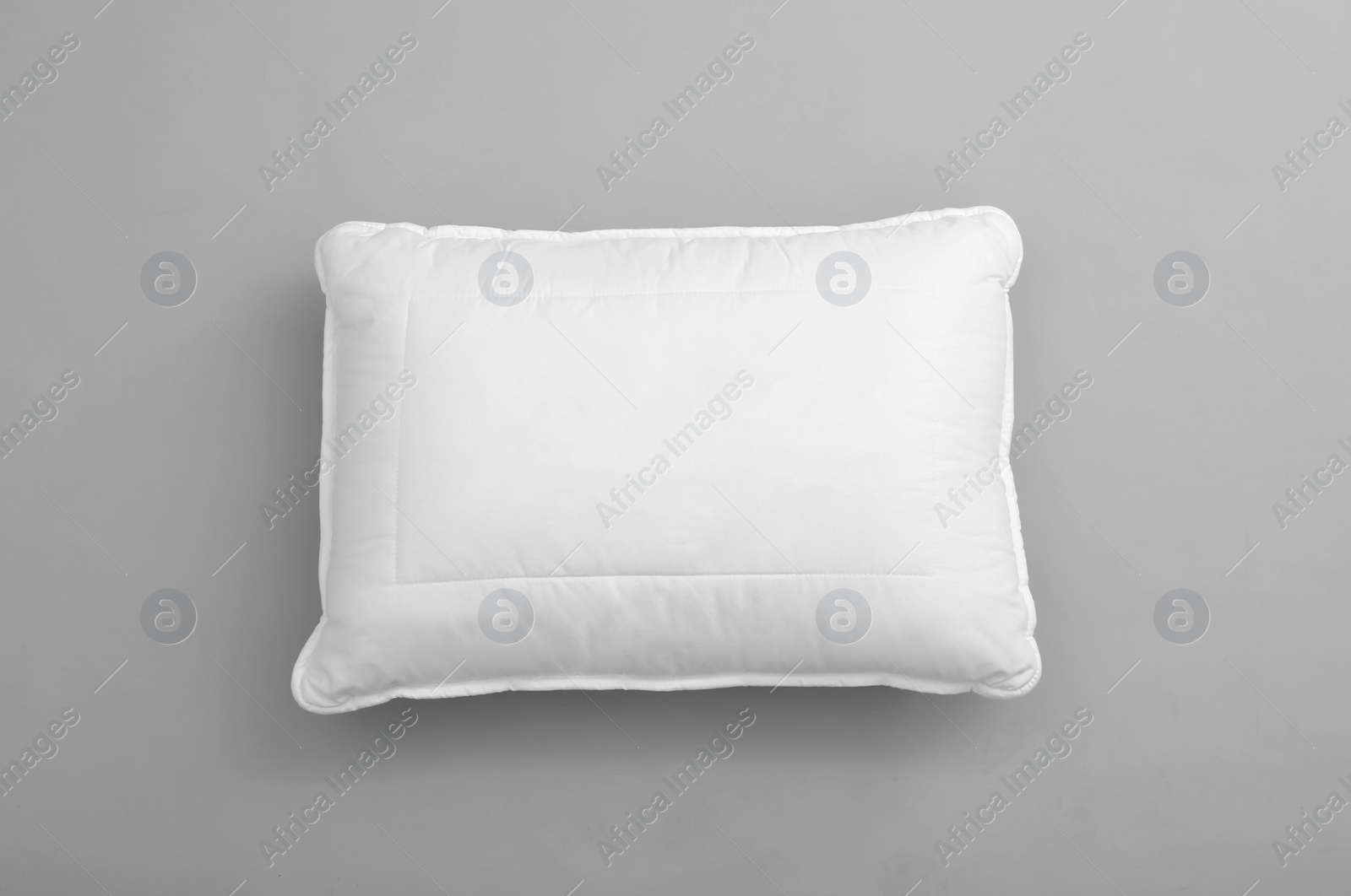 Photo of Clean soft bed pillow on grey background, top view