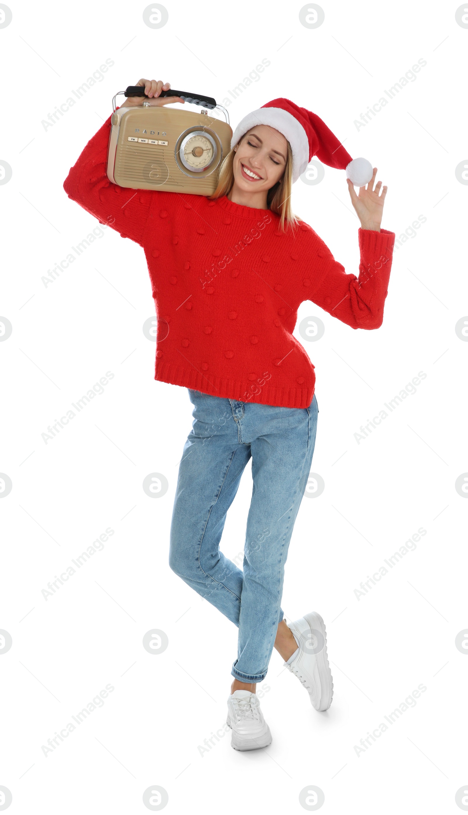 Photo of Happy woman with vintage radio on white background. Christmas music