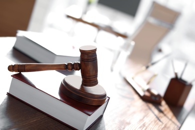 Photo of Gavel and book on table in lawyer's office