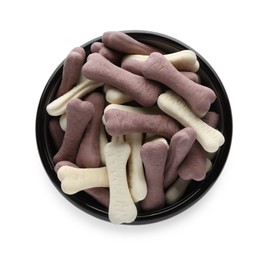 Photo of Different bone shaped dog cookies in feeding bowl isolated on white, top view