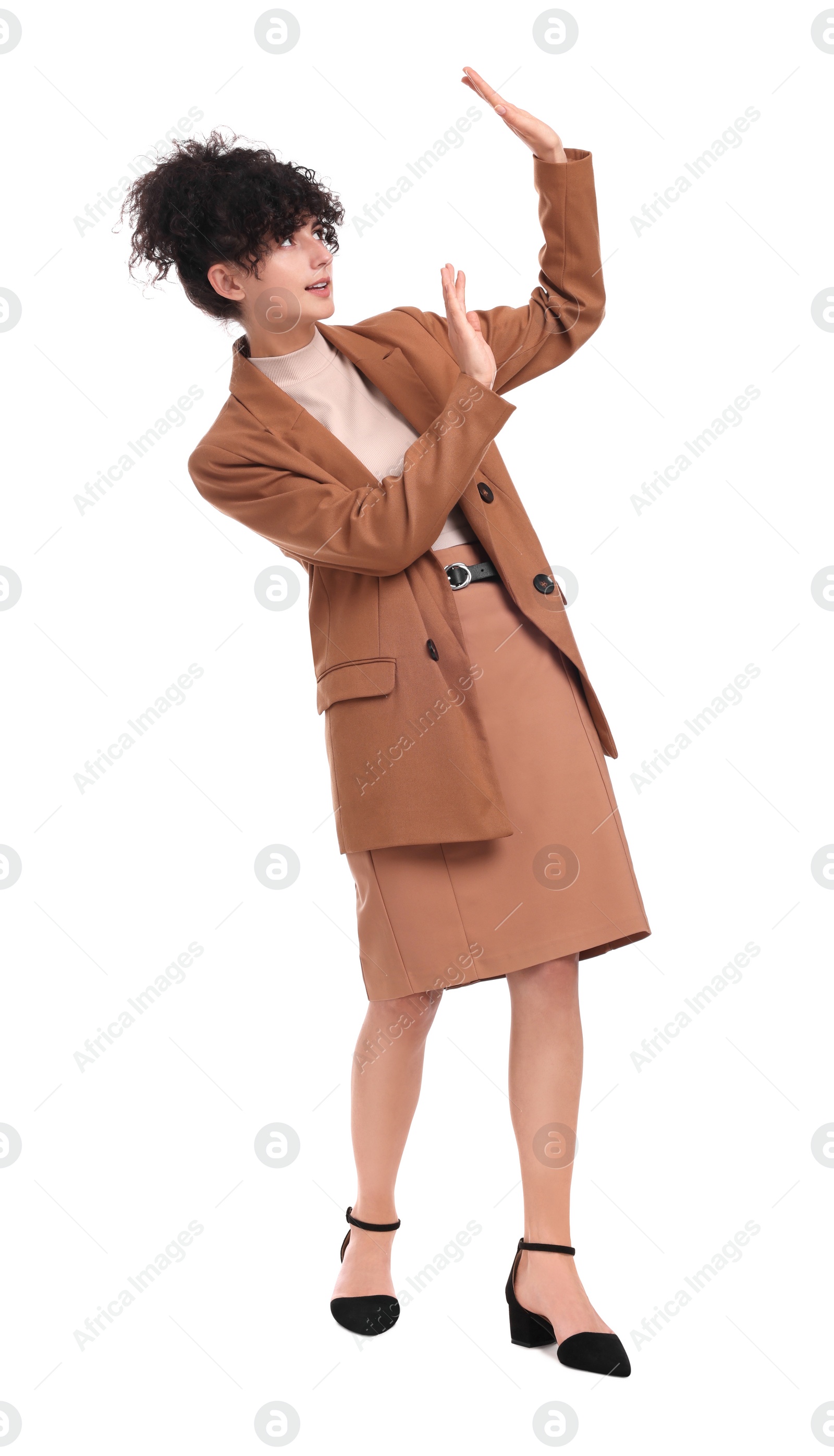 Photo of Beautiful businesswoman in suit avoiding something on white background