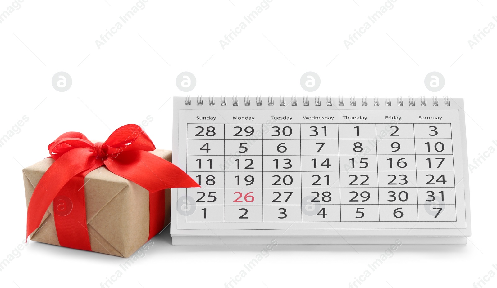 Photo of Paper calendar and gift box on white background. Christmas countdown