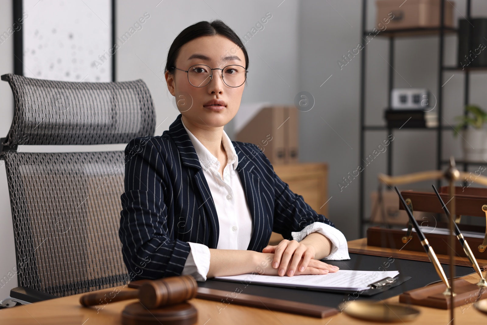 Photo of Portrait of notary at table in office