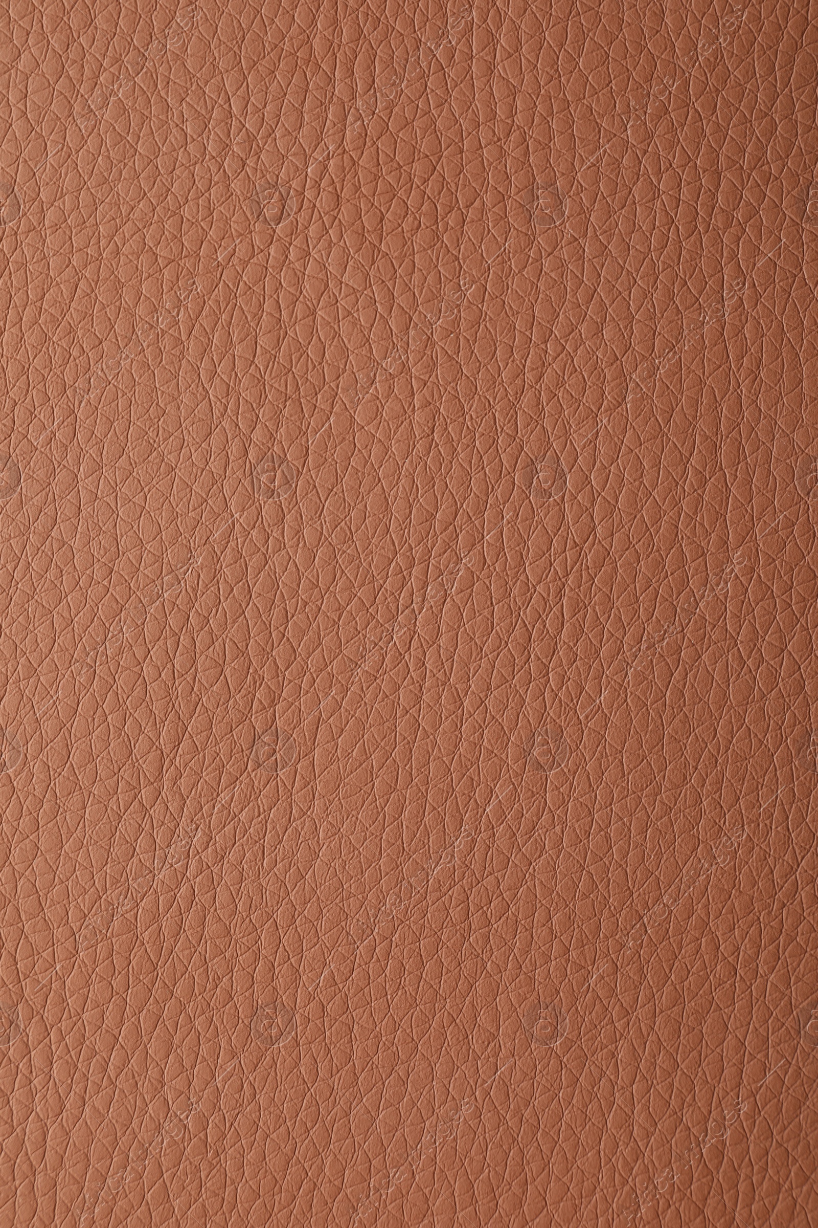 Photo of Texture of light brown leather as background, closeup