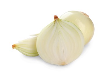 Photo of Whole and cut onions on white background