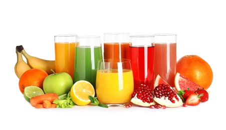 Photo of Glasses with different juices and fresh fruits on white background