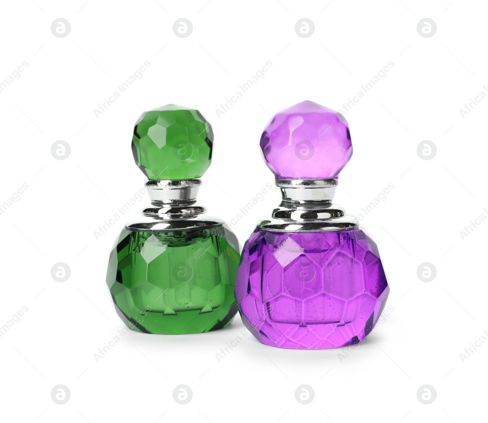 Photo of Bottles of luxury perfume isolated on white