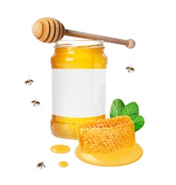 Sweet honey in glass jar with blank label, piece of honeycomb and flying bees on white background. Mockup for design