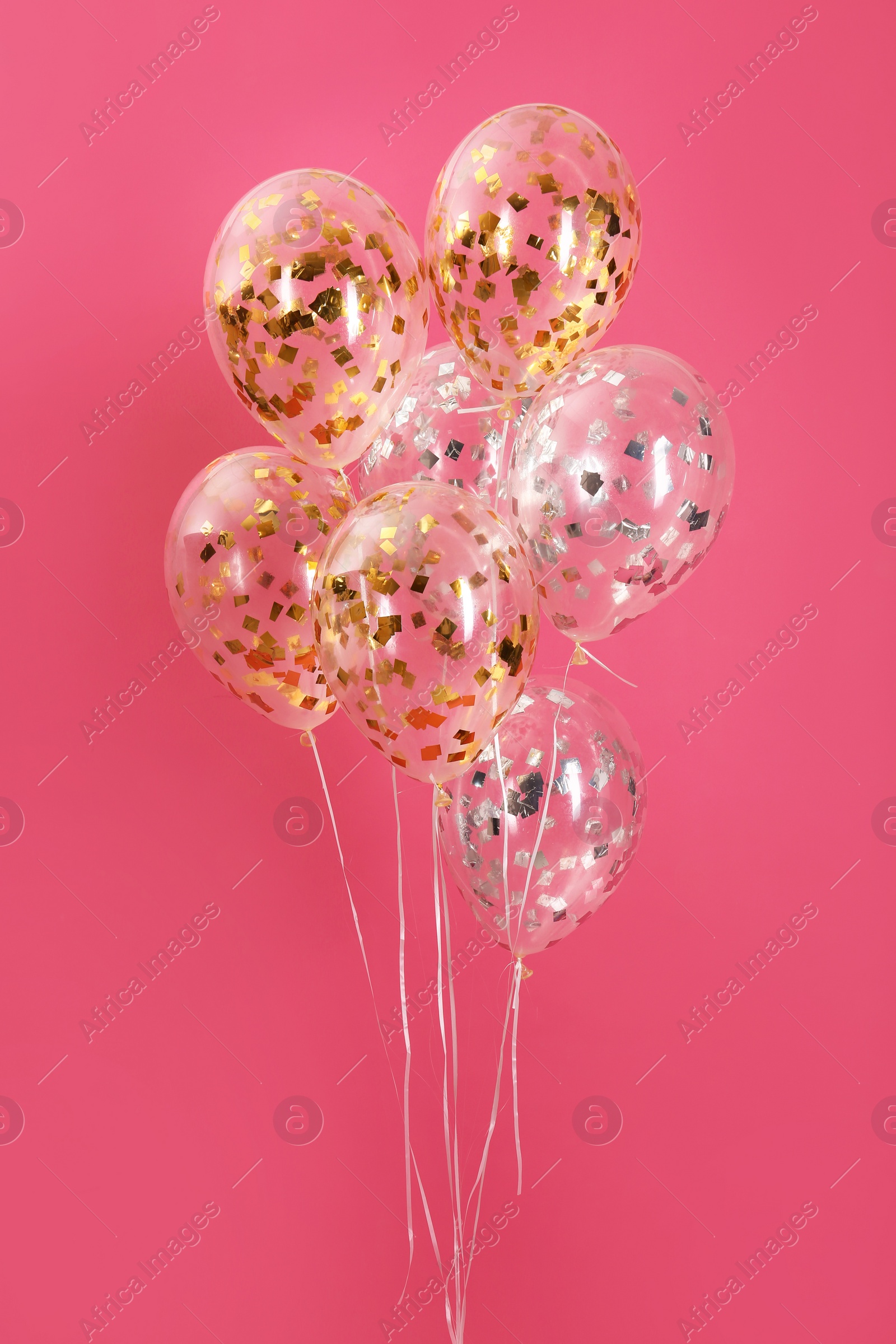 Photo of Bunch of bright balloons on color background