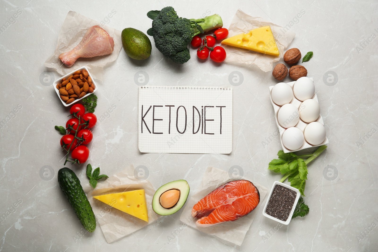 Photo of Flat lay composition with keto diet products on light grey marble table