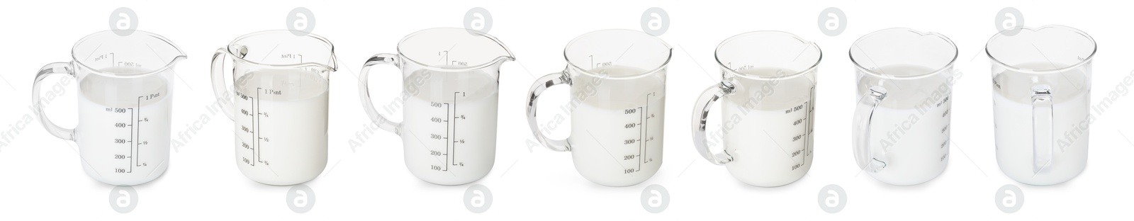 Image of Fresh milk in measuring cup isolated on white, set