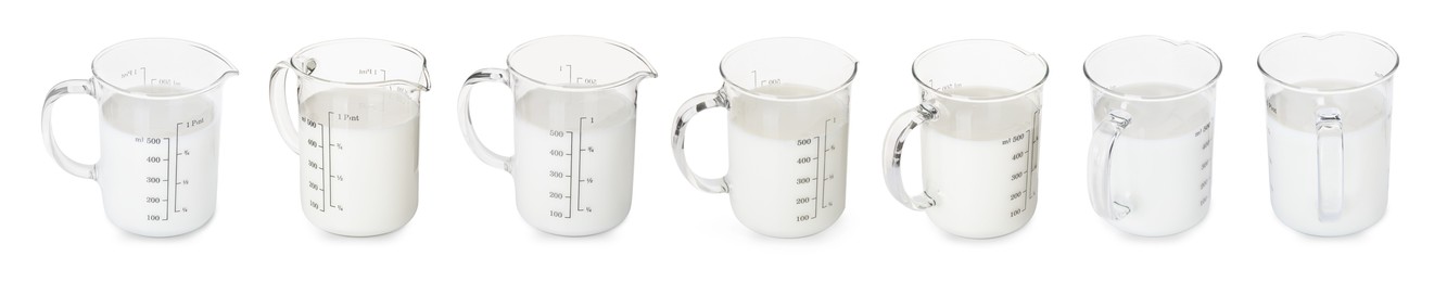 Image of Fresh milk in measuring cup isolated on white, set