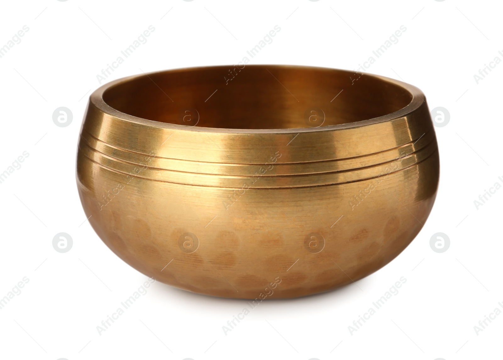 Photo of Golden singing bowl isolated on white. Sound healing