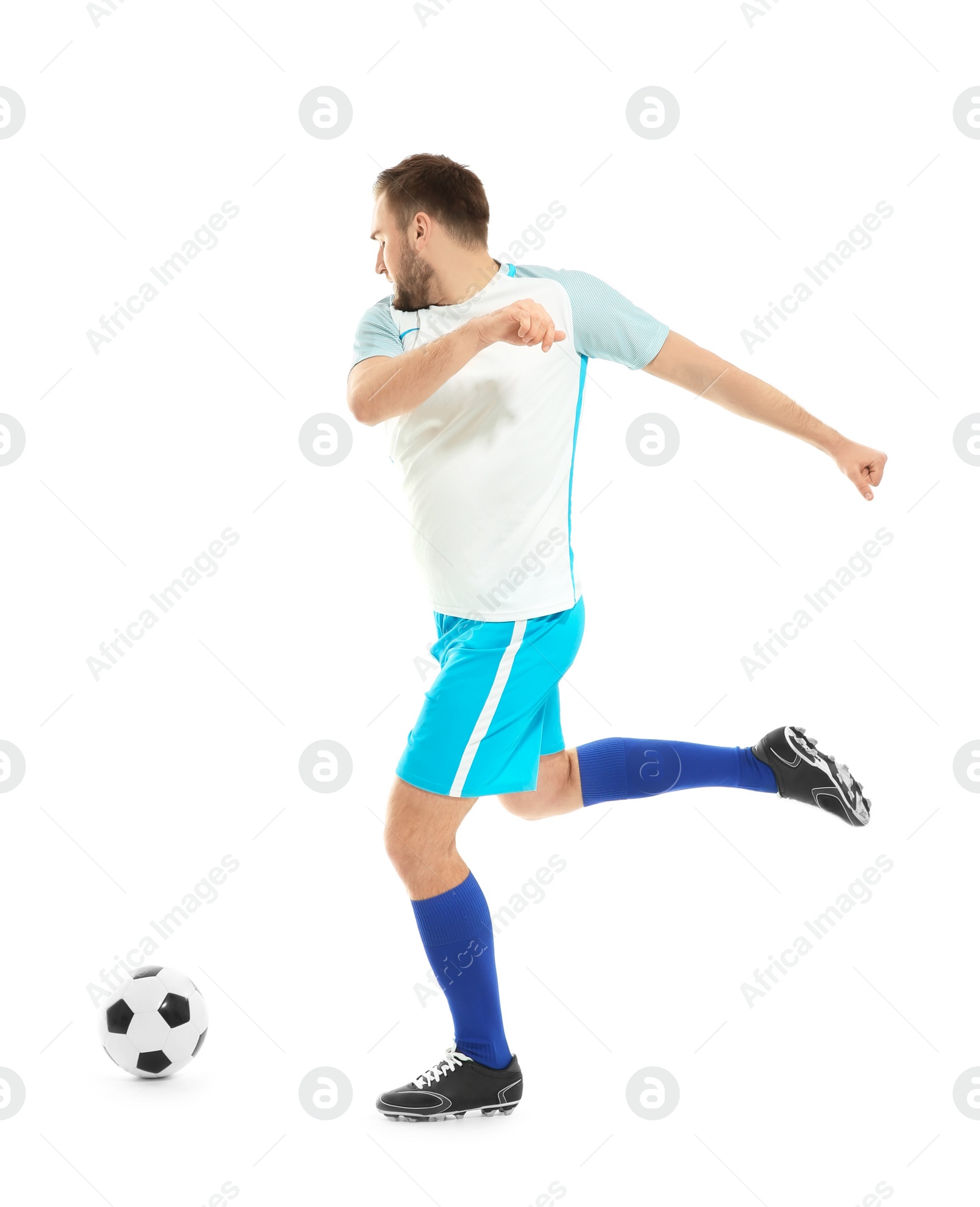 Photo of Young man playing football on white background