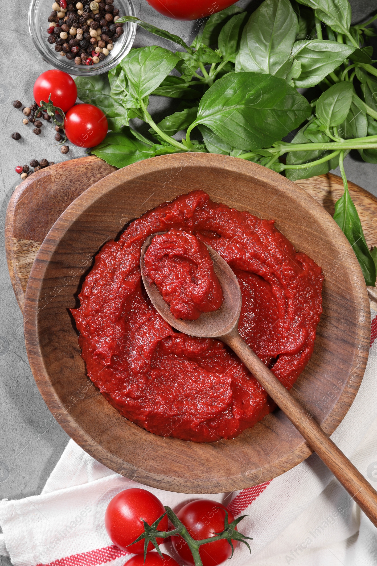 Photo of Tasty tomato paste and ingredients on table, flat lay