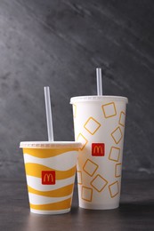 MYKOLAIV, UKRAINE - AUGUST 12, 2021: Cold McDonald's drinks on grey table