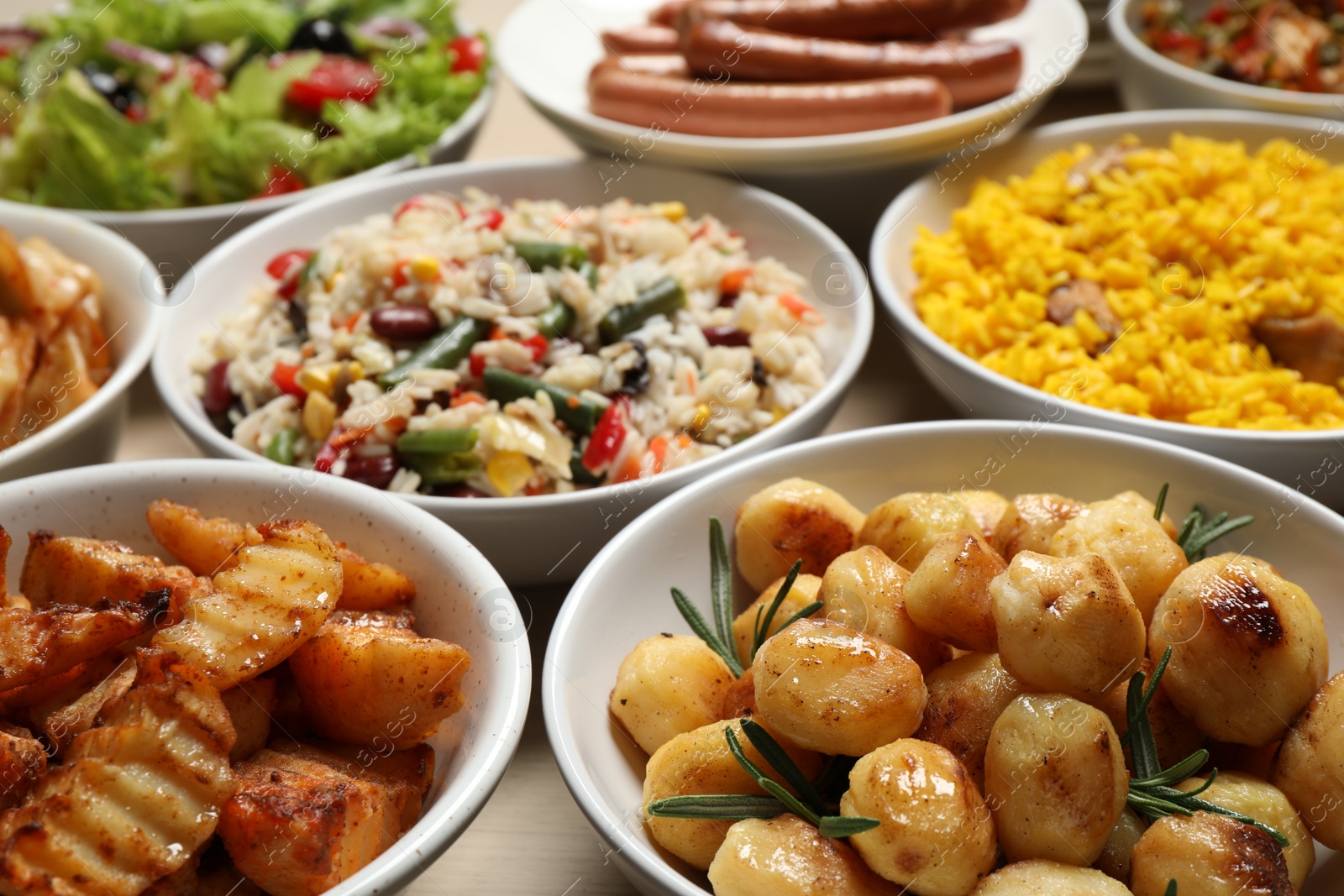 Photo of Different delicious dishes on table, closeup. Buffet service