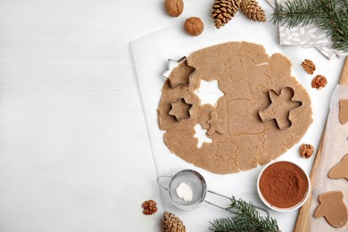 Photo of Homemade Christmas cookies. Flat lay composition with dough on white table, space for text
