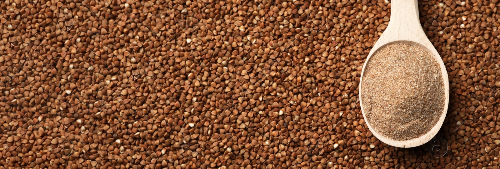 Image of Spoon of buckwheat flour on grains, top view with space for text. Banner design