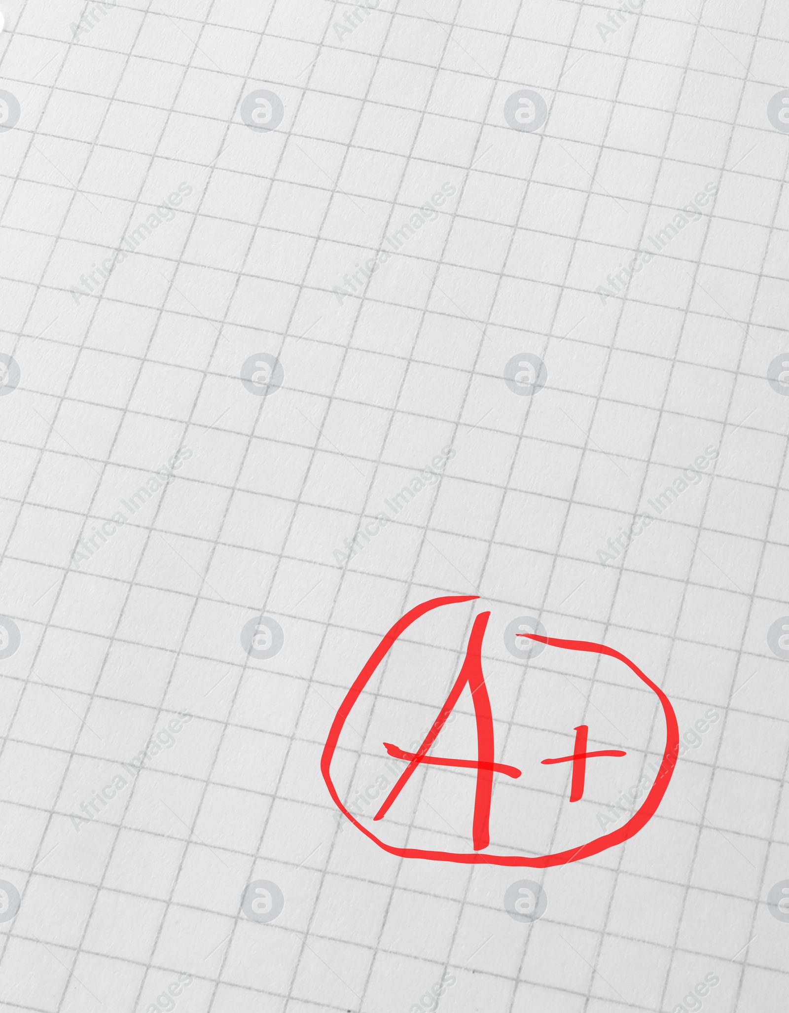 Image of School grade. Red letter A with plus symbol on notebook paper