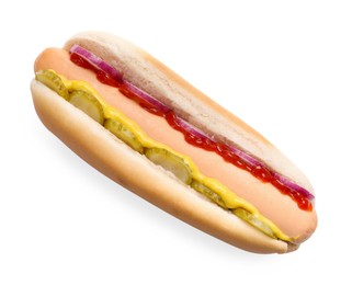 Photo of Delicious hot dog with onion, pickle and sauces isolated on white, top view