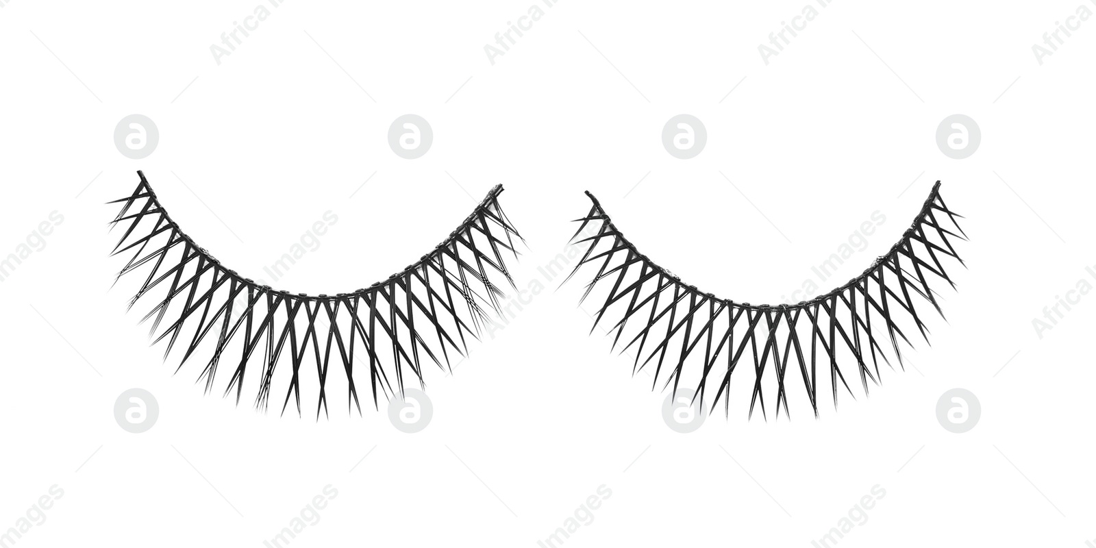 Photo of Fake eyelashes on white background, top view. Makeup product