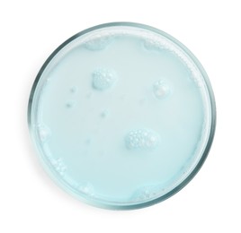 Photo of Petri dish with light blue liquid sample on white background, top view