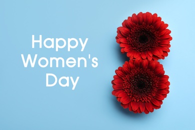Image of Number 8 made with red gerberas on light blue background, flat lay. Happy Women's day