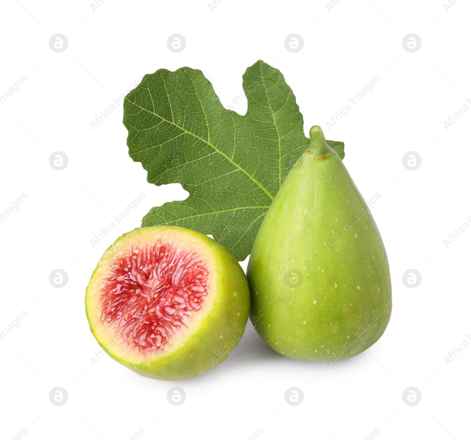 Photo of Cut and whole green figs with leaf isolated on white