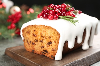 Photo of Traditional Christmas cake on grey table, closeup. Classic recipe
