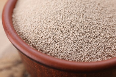 Bowl of active dry yeast, closeup view