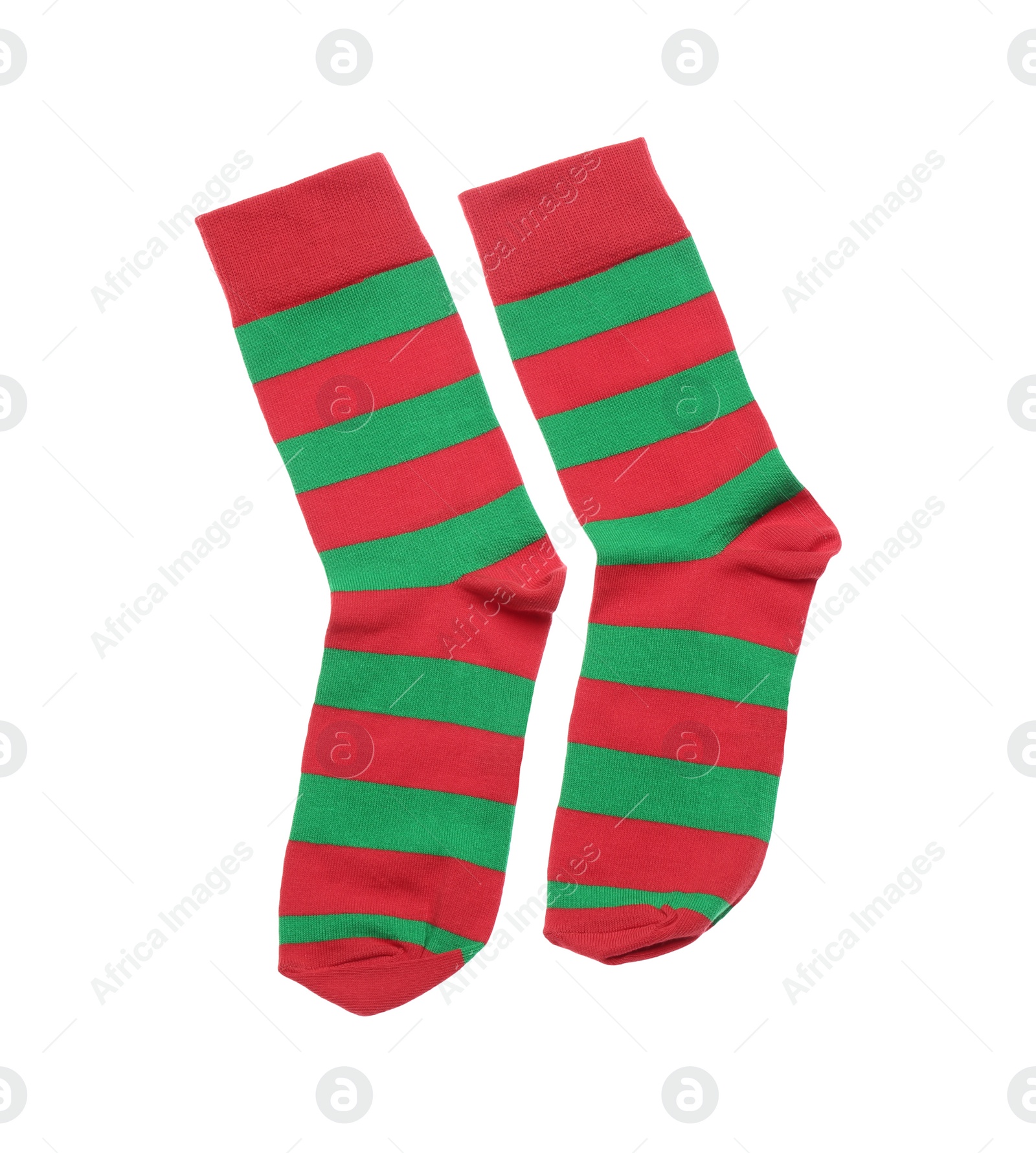 Photo of Red and green striped socks on white background, top view