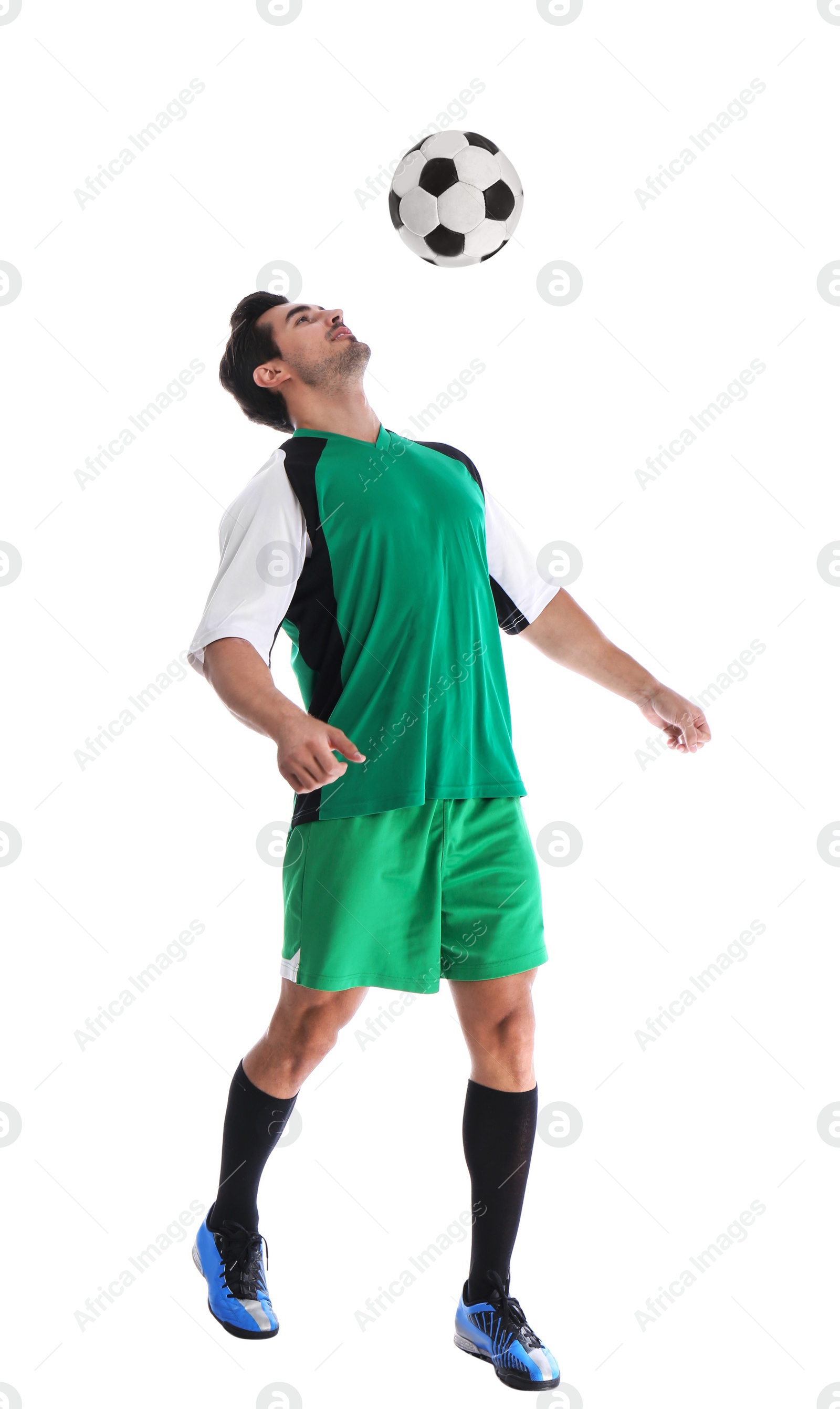 Photo of Young man playing football on white background