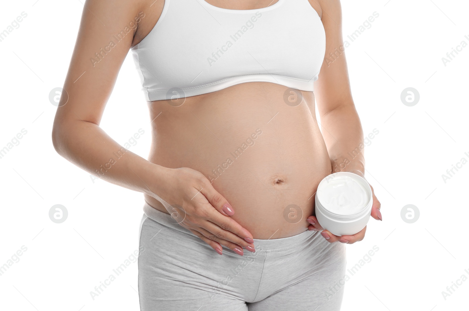 Photo of Pregnant woman holding body cream on white background, closeup