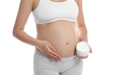 Pregnant woman holding body cream on white background, closeup