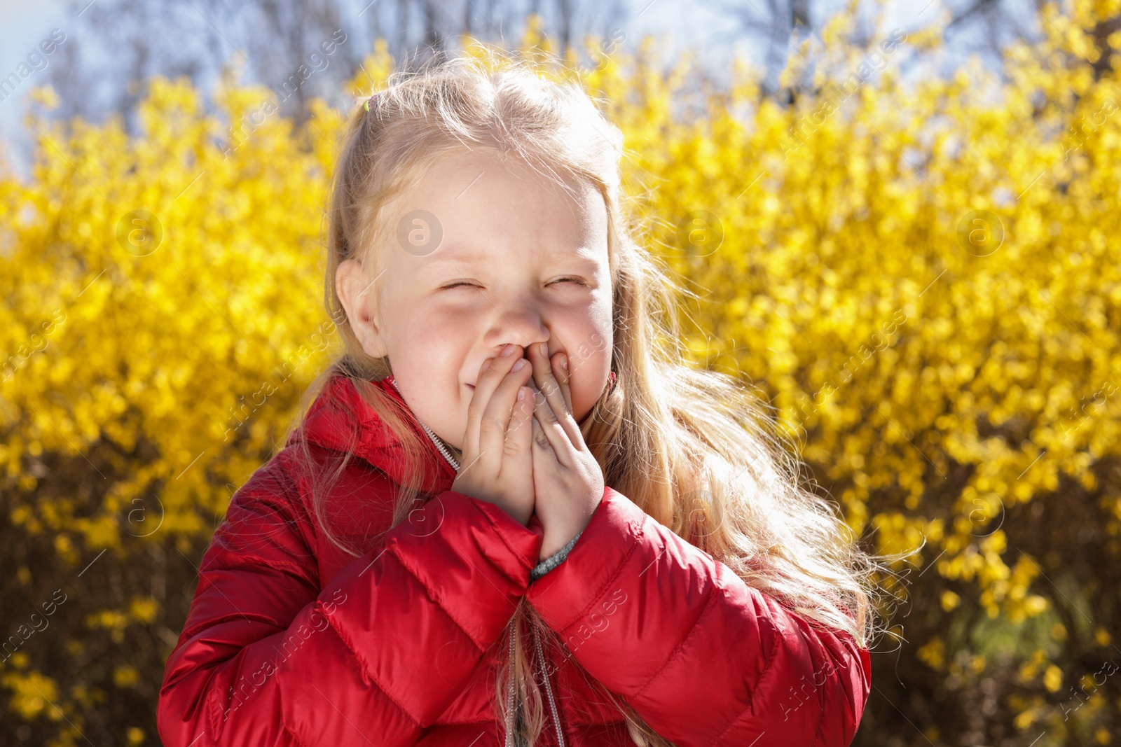 Photo of Little girl suffering from seasonal allergy outdoors