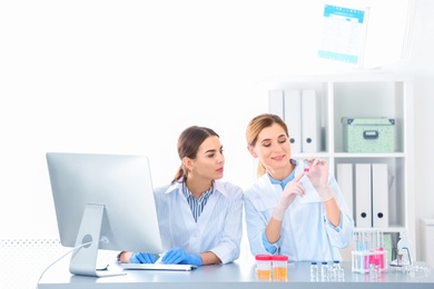 Photo of Scientists working in laboratory. Research and analysis