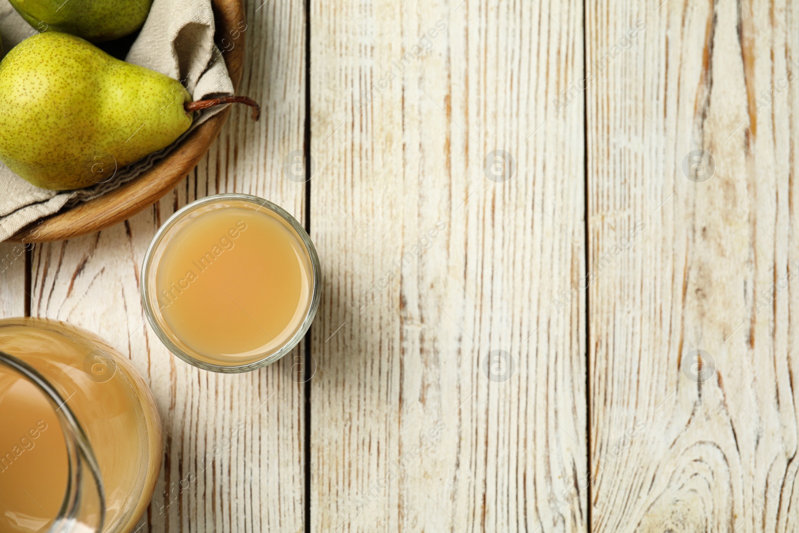 Photo of Tasty pear juice and fruits on white wooden table, flat lay. Space for text