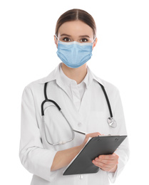 Young doctor in medical mask on white background