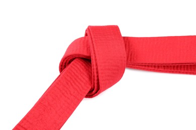 Photo of Red karate belt isolated on white. Martial arts uniform