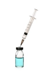 Photo of Syringe with vial of medicine isolated on white