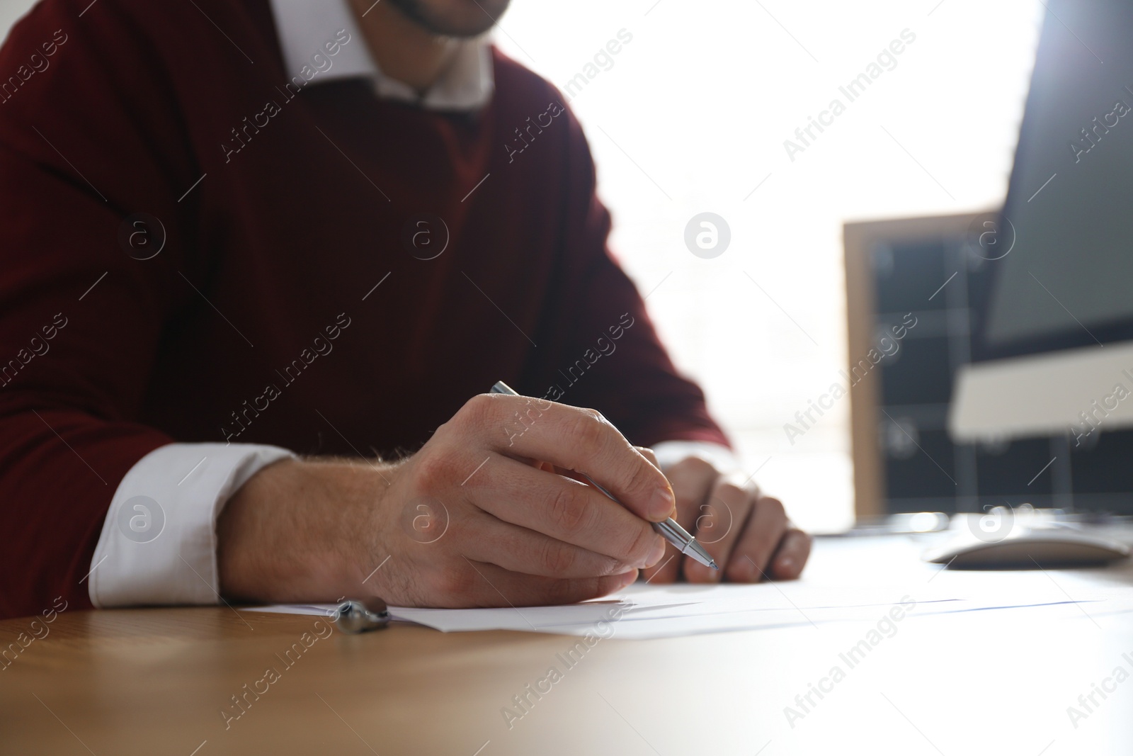 Photo of Freelancer working at table in home office, closeup